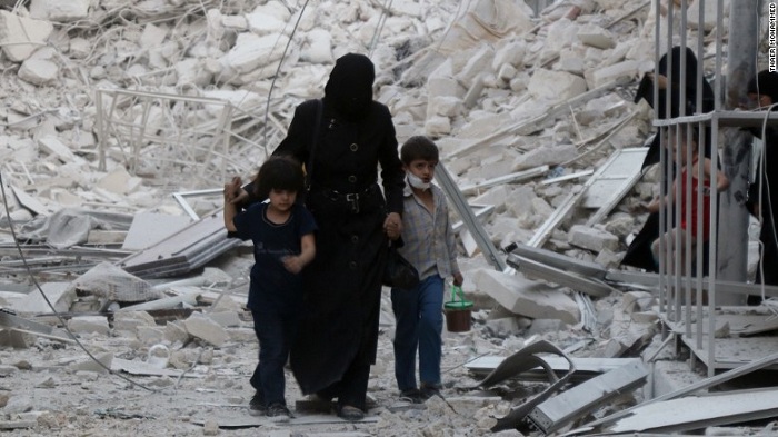 Syria war: White Helmets group says aid center hit by barrel bomb